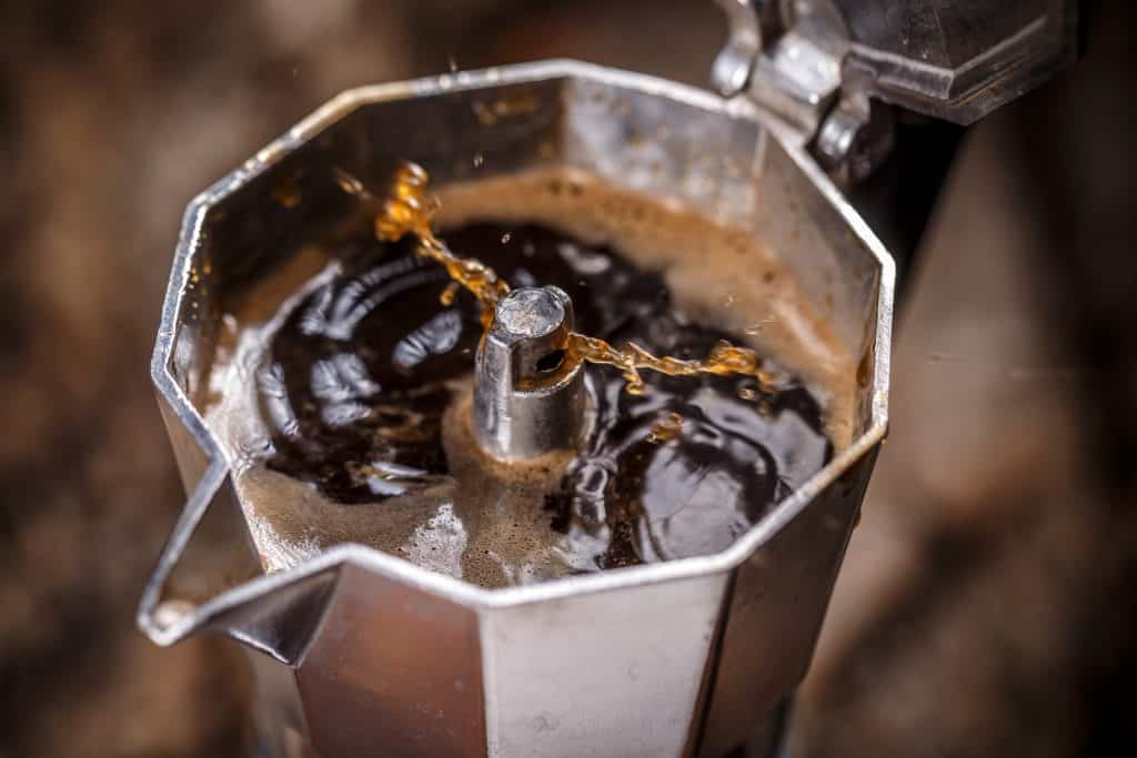 Crema building on a freshly brewed espresso in a Moka Pot