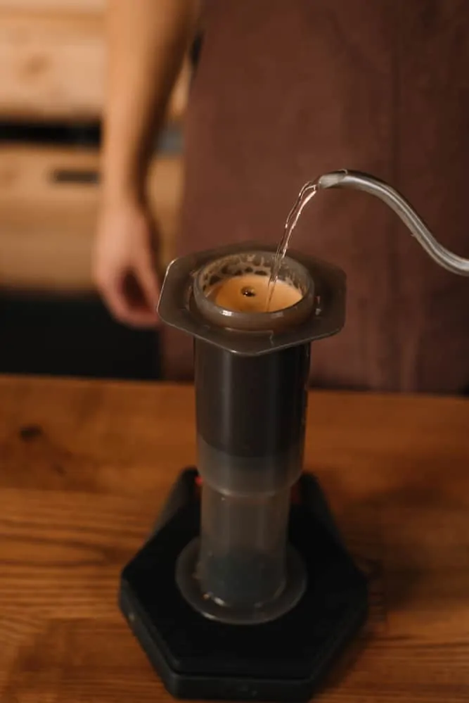 Filling up the Aeropress brewer with water