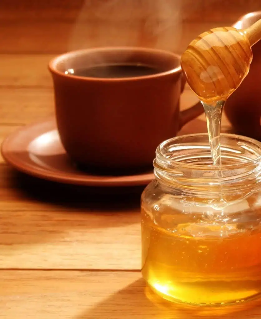 Sweetening coffee with honey