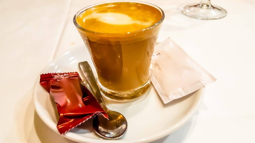 Cortado at Coffee Shop served in a glass cup