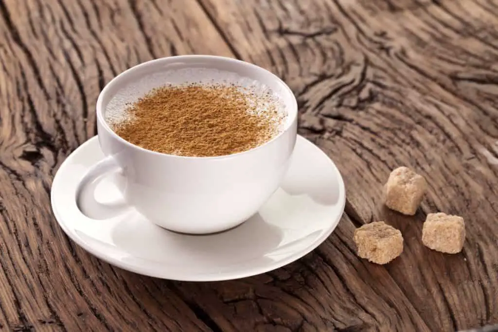 Showing a cup of cappuccino with sugar to answer the question whether Starbucks Cappuccino has Sugar or not